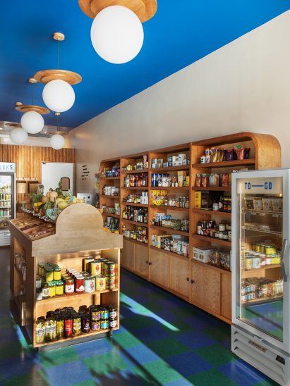 Vinyl checkerboard floor tiles and wooden shelving