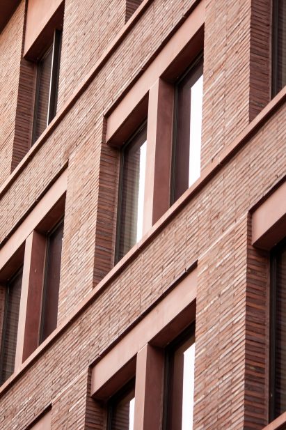 Roman brick and red concrete of 11-19 Jane Street