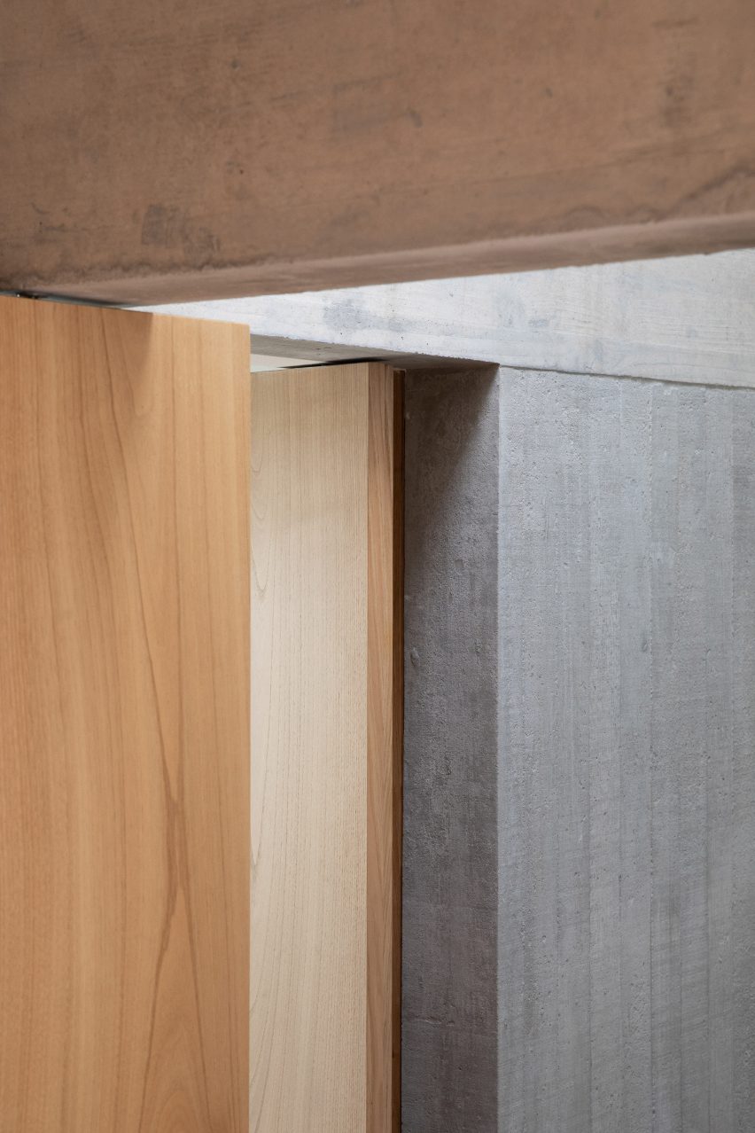 Warm woods contrast with raw concrete