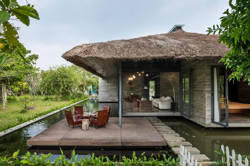 House surrounded by pond