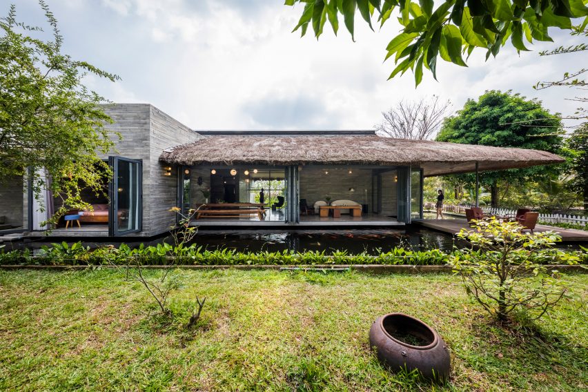 The exterior of a thatched roof house