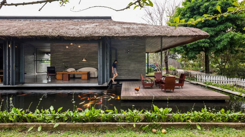 A Vietnamese holiday home with a thatched roof