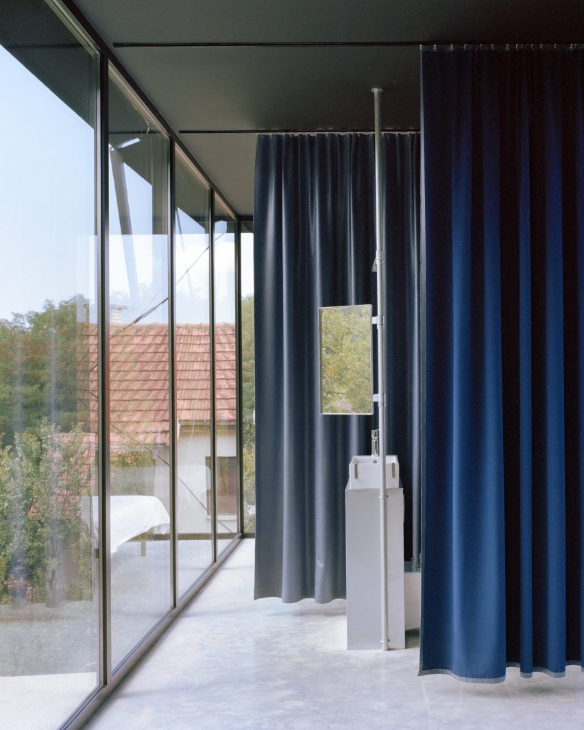 A bathroom with curtain partitions