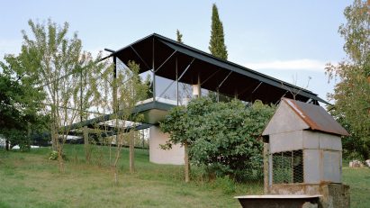 A steel-framed house on a mountainside