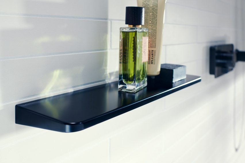 A black bathroom shelf
