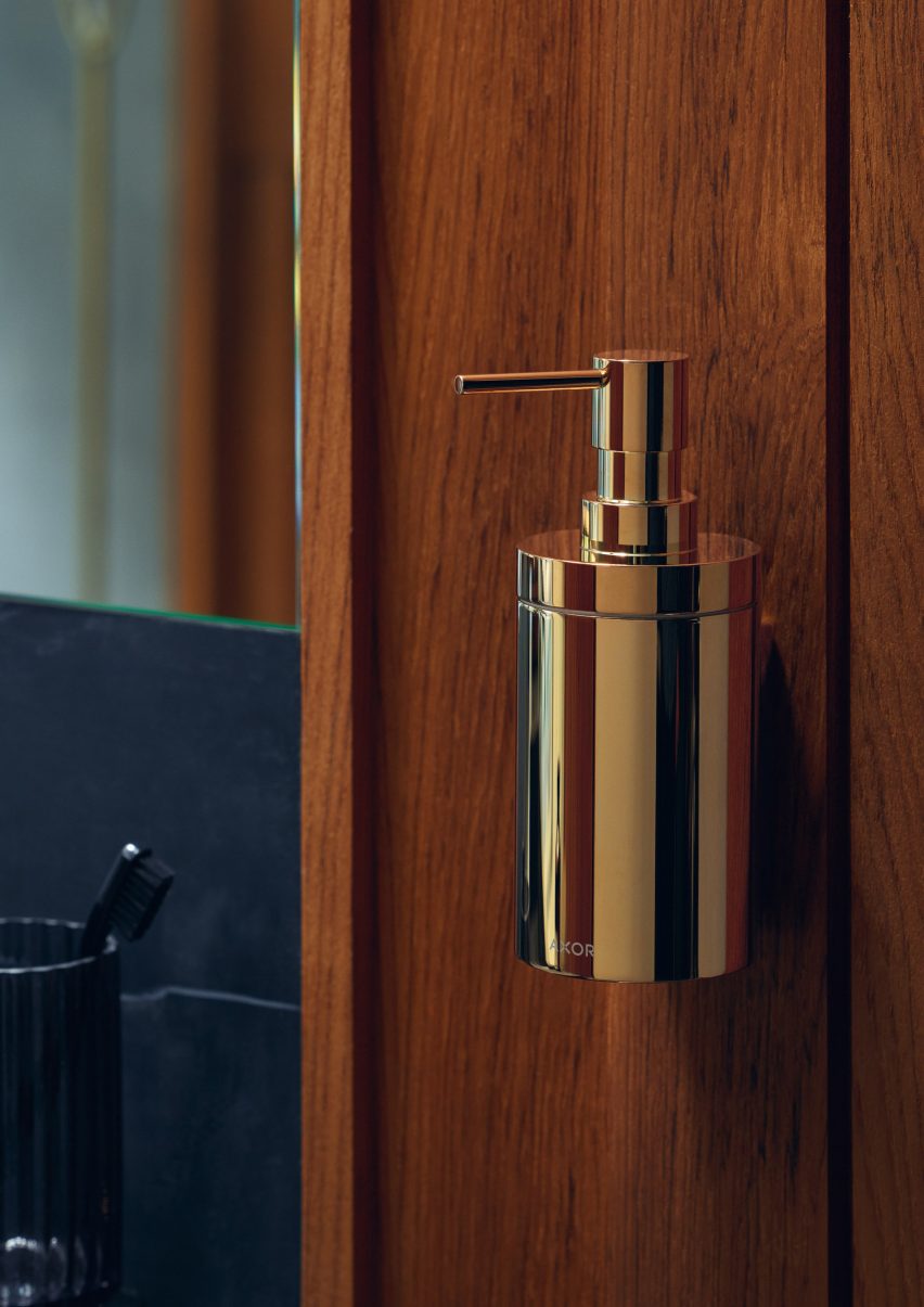 A gold-coloured soap dispenser