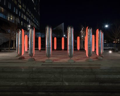 The pillars are two-tone, with reflective silver on the outside and translucent white insides fitted with LED lights