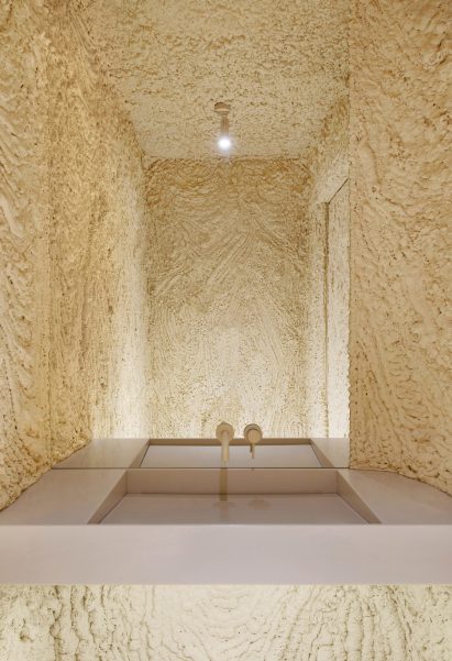 Foam-covered walls of cafe bathroom