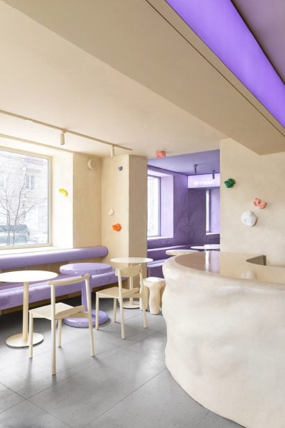 Beige walls and colourful sculptures in a Russian cafe