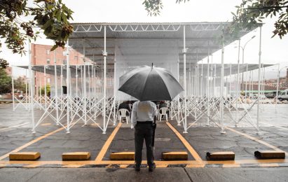 Mosquito nets and construction materials form temporary church