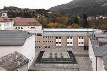 Plaza above new conference hall at Cusanus Academy renovation by MoDus Architects