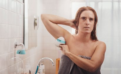Degree Inclusive deodorant being used by a woman with visual impairment