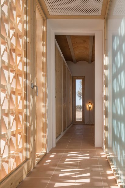 Pale wood was used for door frames and windows by Maria Castello