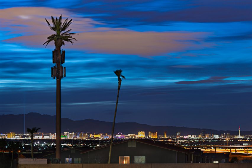 Night over cell tower trees