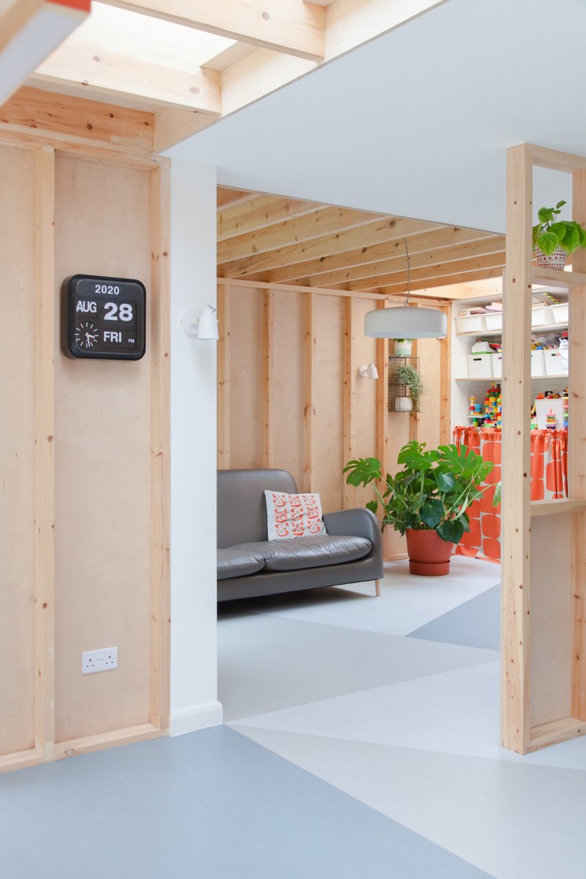 A living room with a wooden lining