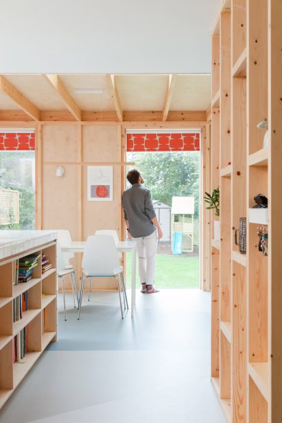A kitchen with an exposed wooden structure