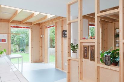 A kitchen with wooden partitions
