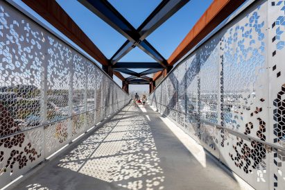 CNC Waterject cut geometric patterns on steel panel guardrails