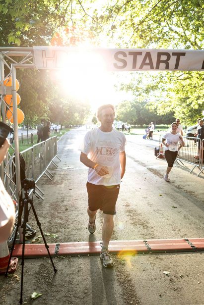 Ivan Harbour crosses the finish line at the HD5K 2019 run