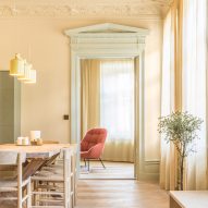 Pale yellow dining room with wooden floors