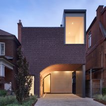 Vaulted tunnel runs through brick house by Batay-Csorba Architects