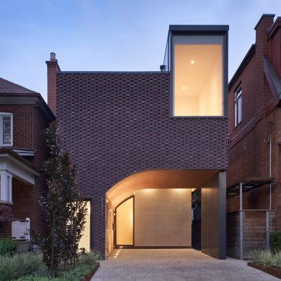 Vaulted tunnel runs through brick house by Batay-Csorba Architects