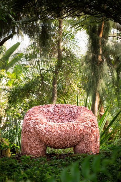Hortensia chair in pink surrounded by plants and greenery