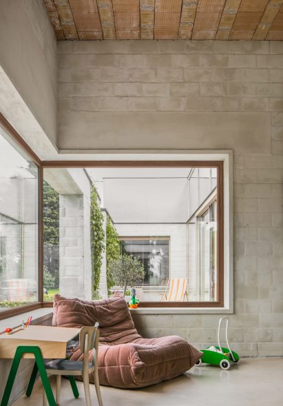 A living room with a corner window