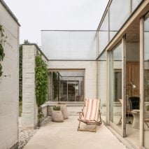 A patio partially enclosed by brick walls