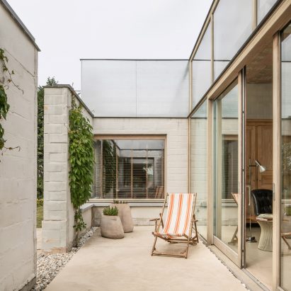 A patio partially enclosed by brick walls