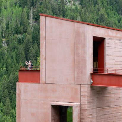 Red concrete exterior of Ibex Museum St Leonhard by Daniela Kröss and Rainer Köberl
