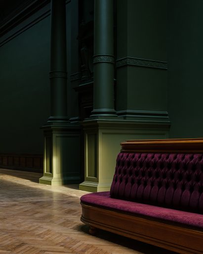 Red sofa and green walls