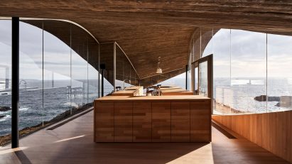 Light-filled kitchen with full height glass walls