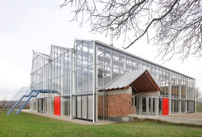 A greenhouse containing old agricultural buildings
