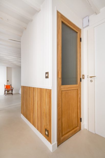 Doors have a stained wood and frosted glass construction