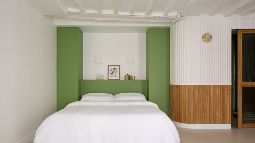 Green walls frame the bed space