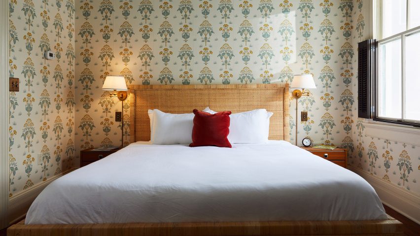 Post House Inn bedroom with printed wallpaper