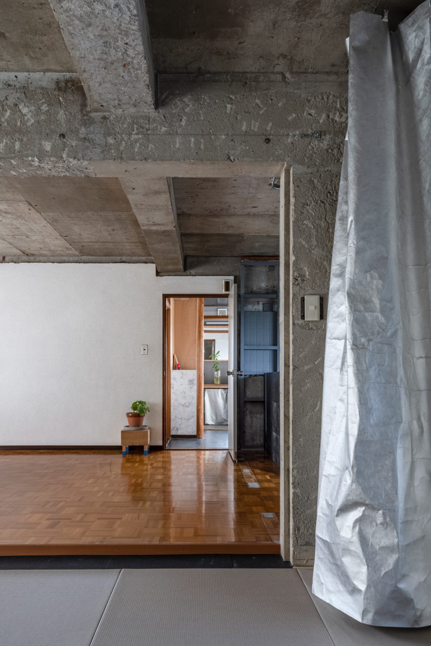 Silver curtain in reception room by Nanometer Architecture