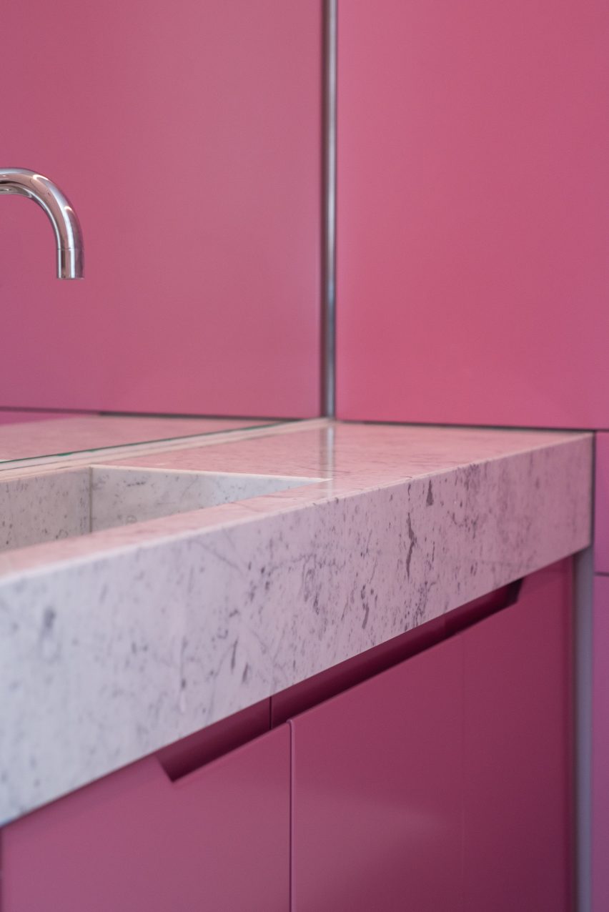 The bathroom has a marble sink
