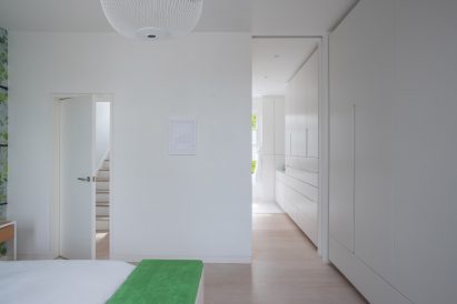 Built-in cabinetry links the ensuite and bedroom