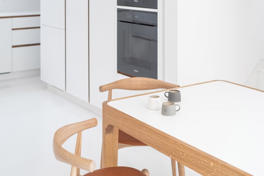 Furniture employs a similar oak and white palette