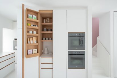 The stairwell was painted pink by Moxon Architects