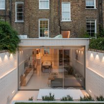 Moxon Architects remodels Victorian terrace with sunken garden and minimalist interiors