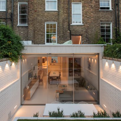 Moxon Architects remodels Victorian terrace with sunken garden and minimalist interiors
