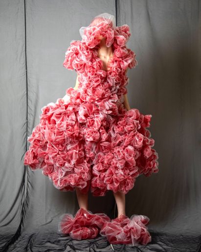 Pink fabric is bunched together