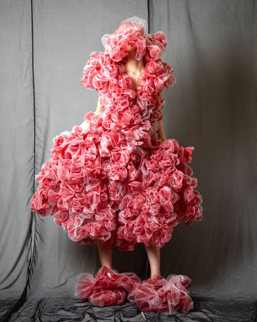 Pink fabric is bunched together