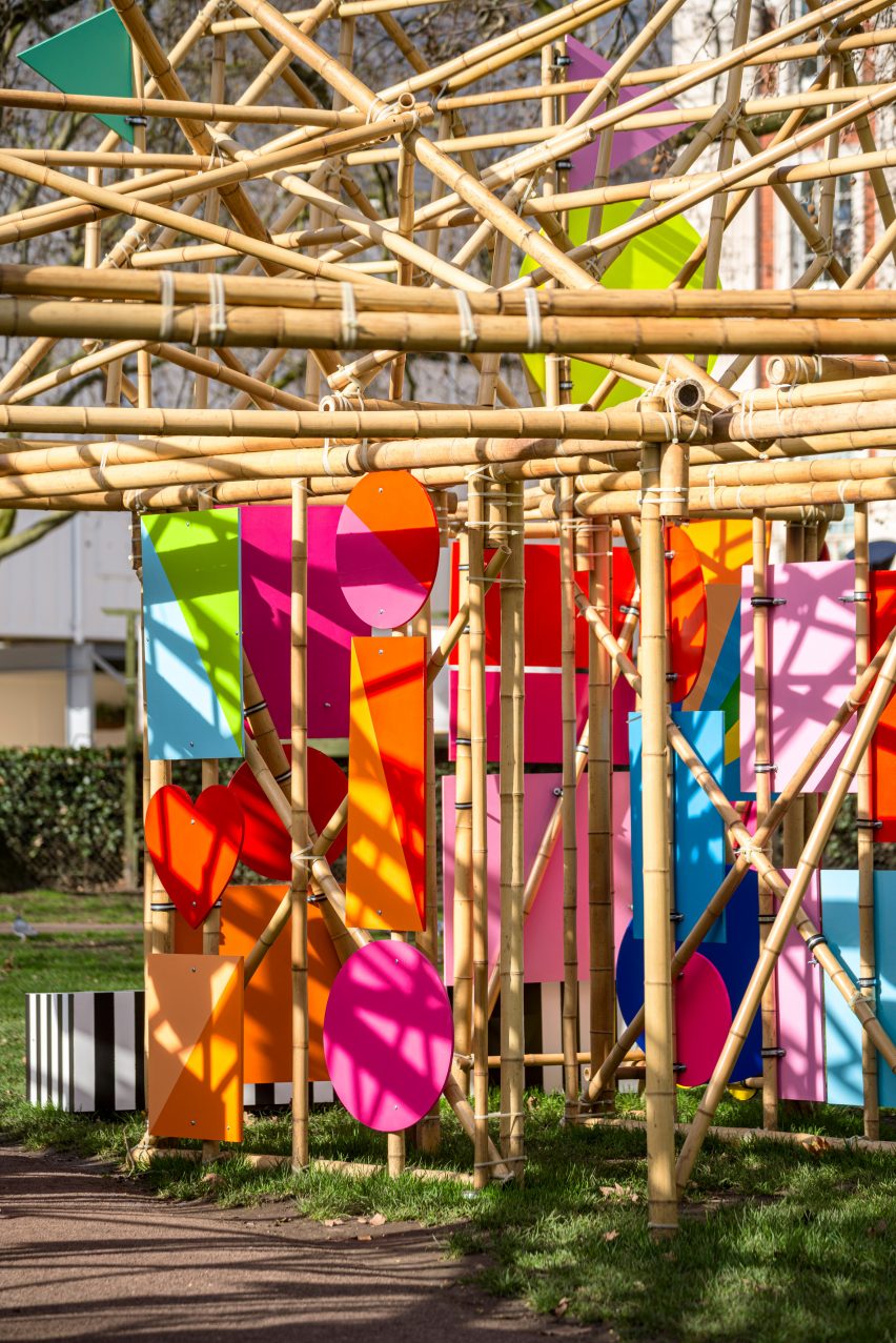 A bamboo pavilion decorated with coloured panels