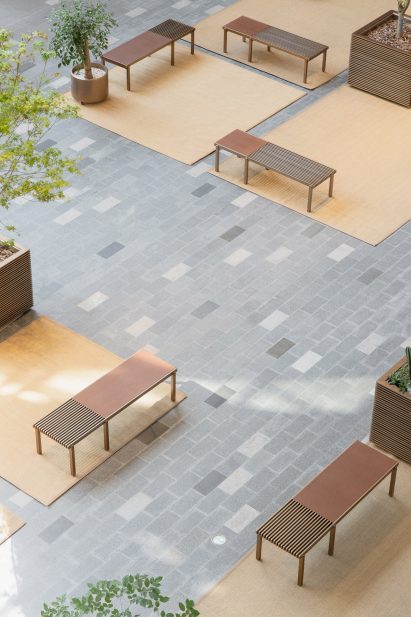 Benches in Xintiandi atrium by AIM Architecture
