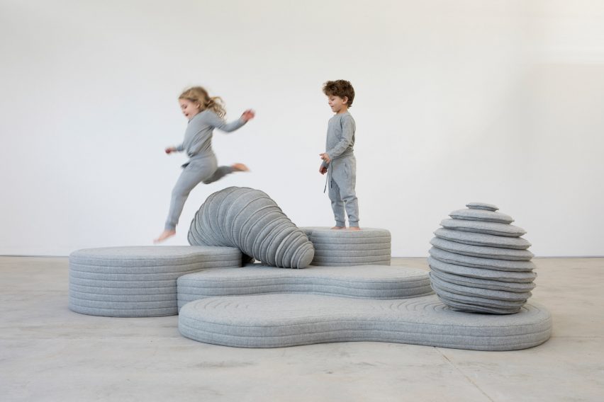 Kids playing on sculptures