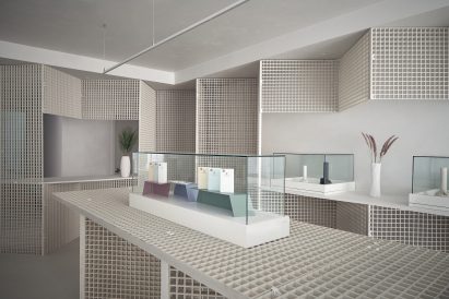 Counter, walls and display tables made from industrial grating in St. Clair West Edition store